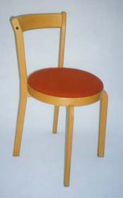 Chair in light beechwood with cognac coloured padded seat
